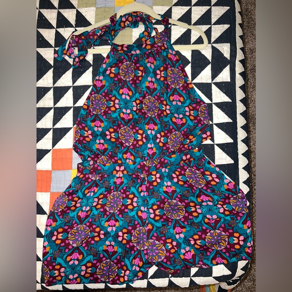 Free people NWT backless romper with a tie around the neck & mid back